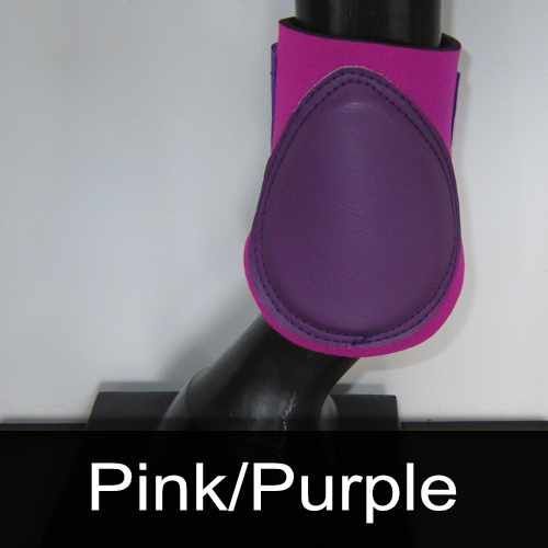 A pink and purple boot on a horse 's leg