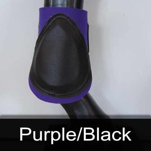 A purple and black boot is on a horse 's leg
