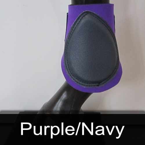 A purple and navy boot is on a horse 's leg
