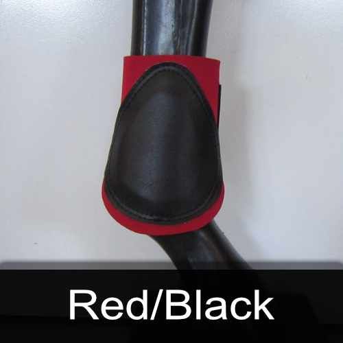 A red and black boot is on a mannequin leg