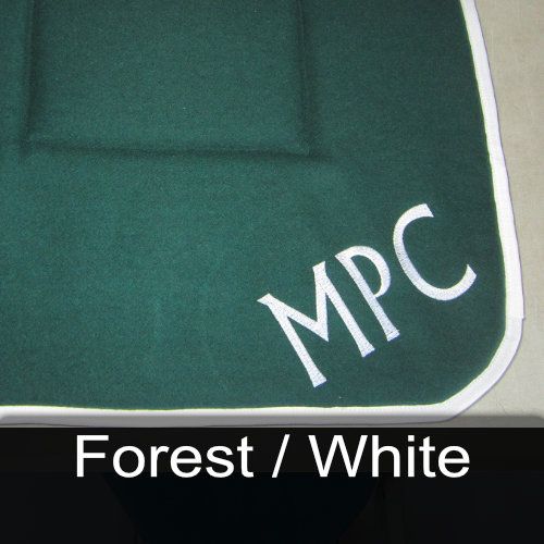 A green mat with the name mpc embroidered on it