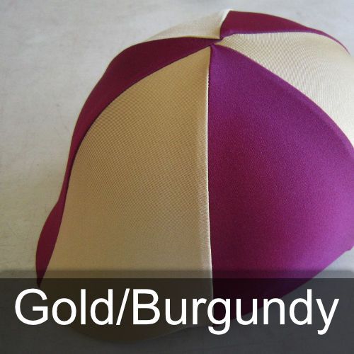 A gold and burgundy hat is sitting on a table