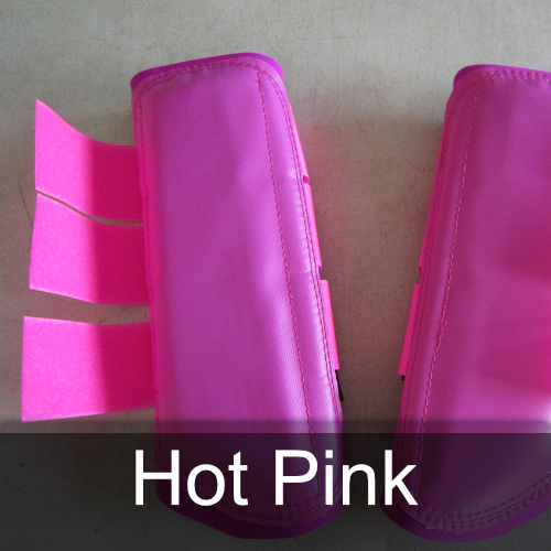 A pair of hot pink boots sit on a table