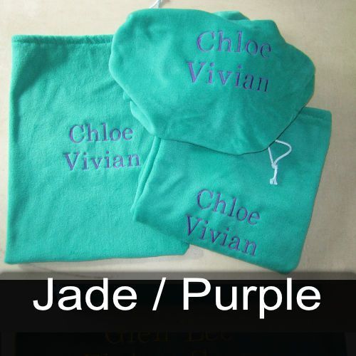A jade and purple towel with chloe vivian embroidered on it