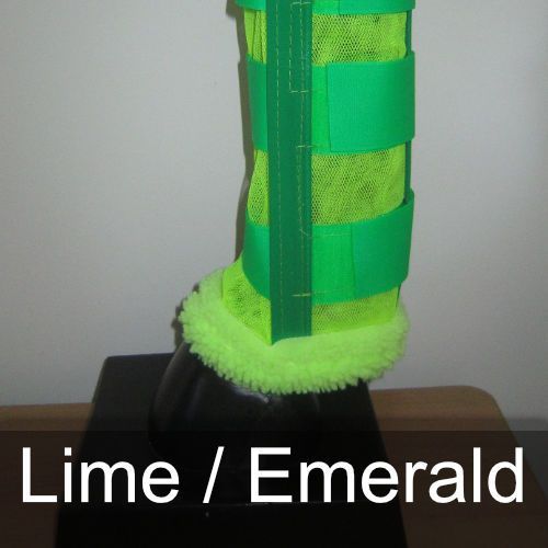 A pair of lime / emerald boots on a table