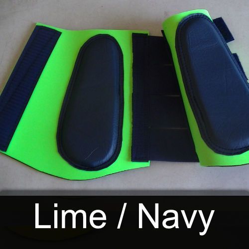A pair of lime and navy knee pads on a table