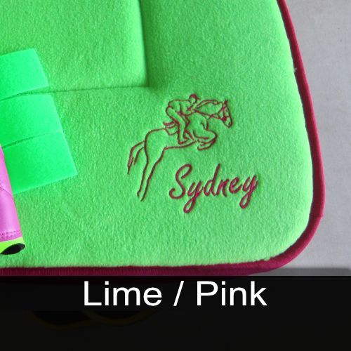 A green saddle pad with the name sydney embroidered on it