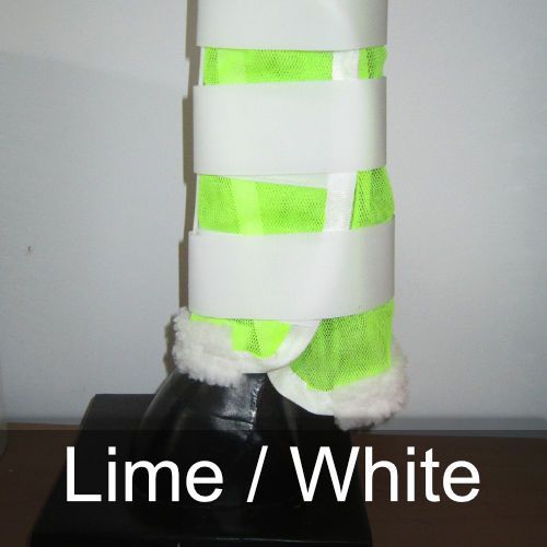 A pair of lime and white boots on a horse