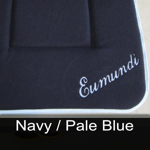 A cushion with the name eumundi embroidered on it