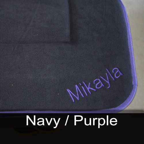 A black item with the name mikayla embroidered on it