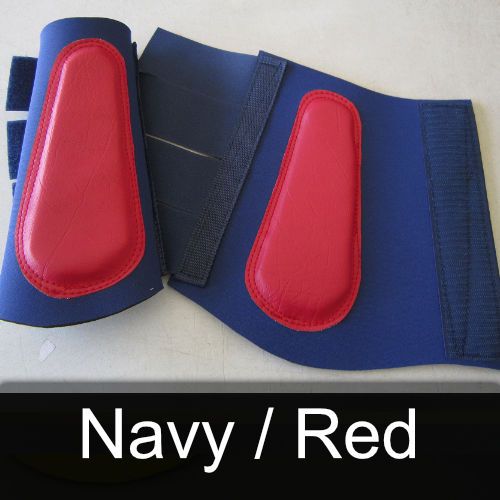 A pair of navy and red knee pads on a table