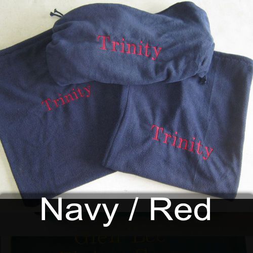A pair of navy and red shirts with trinity embroidered on them