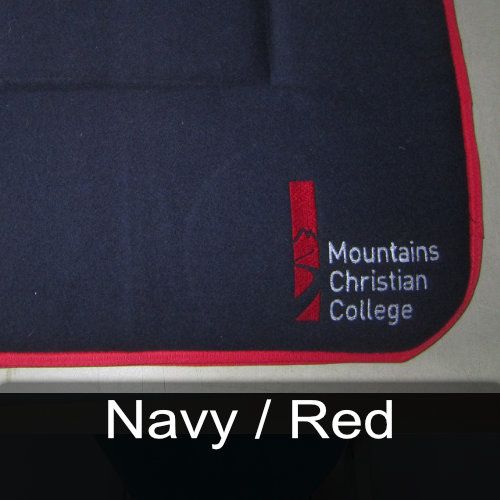 A blue cloth with the words mountains christian college embroidered on it