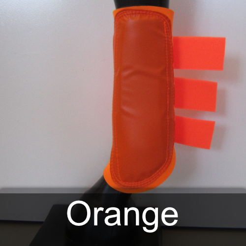 A pair of orange boots on a mannequin