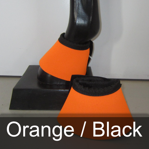 A pair of orange and black bell boots on a mannequin