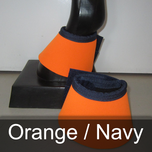 A pair of orange and navy bell boots on a mannequin