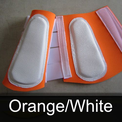 A pair of orange and white leg protectors