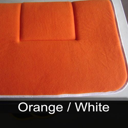 An orange cushion with the words orange / white below it