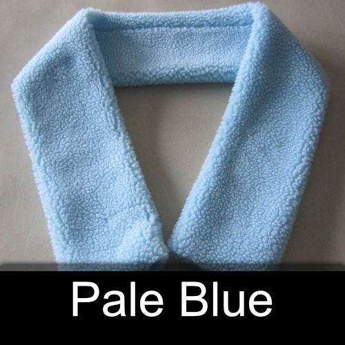 A pale blue scarf is sitting on a table