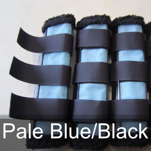 A pair of pale blue and black leg protectors