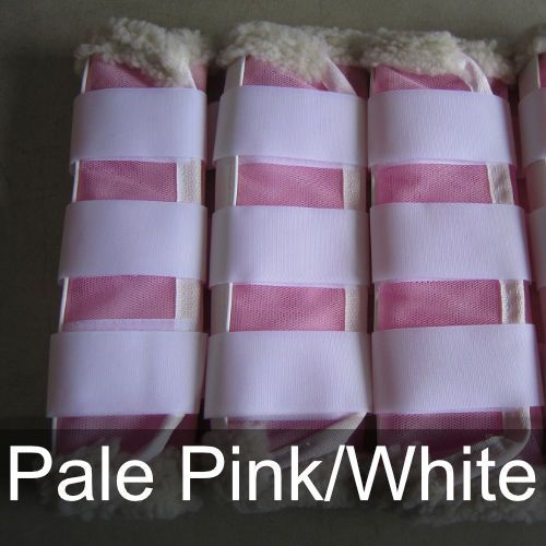 A pair of pale pink and white horse boots