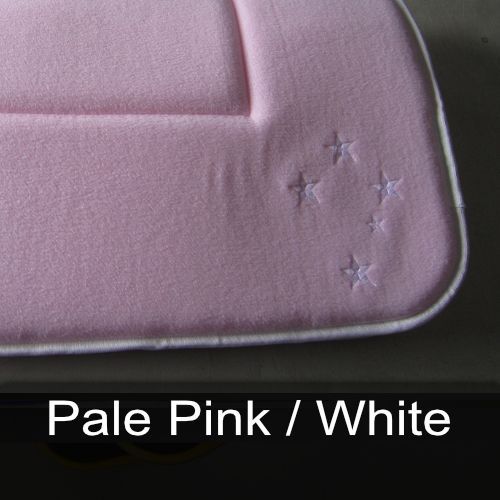A pale pink / white blanket with stars embroidered on it