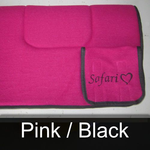 A pink blanket with the word safari embroidered on it