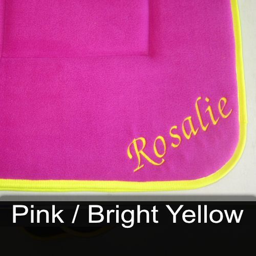 A pink towel with the name rosalie embroidered on it