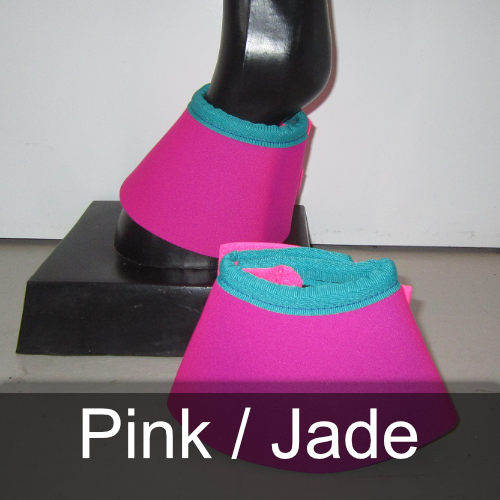 A pair of pink and jade bell boots on a mannequin