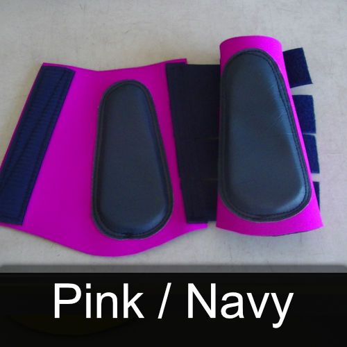 A pair of pink and navy boots on a table