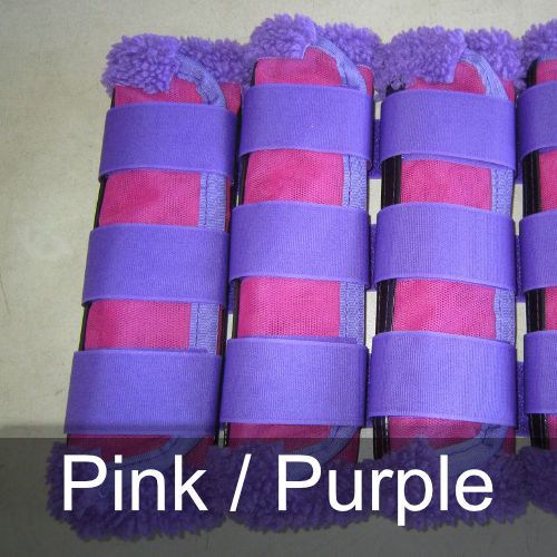 A row of pink and purple boots with the words pink / purple below them