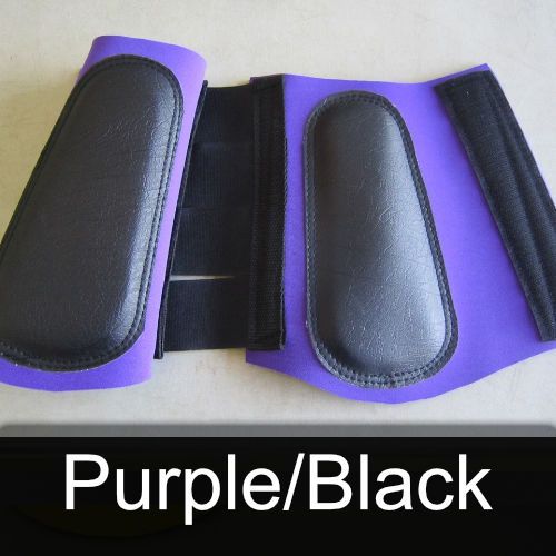 A pair of purple and black knee pads on a table