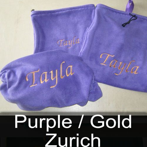 A purple blanket with the name tayla embroidered on it
