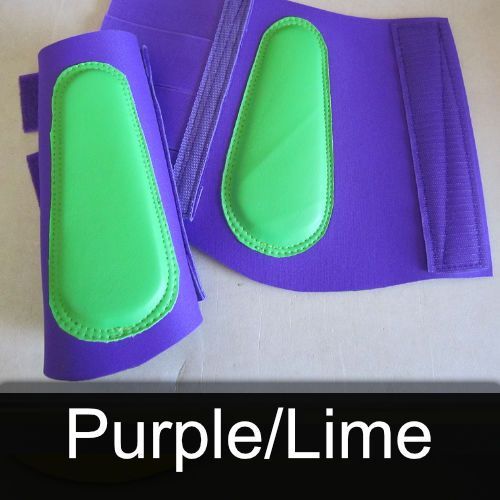 A pair of purple and green boots with the words purple / lime below them