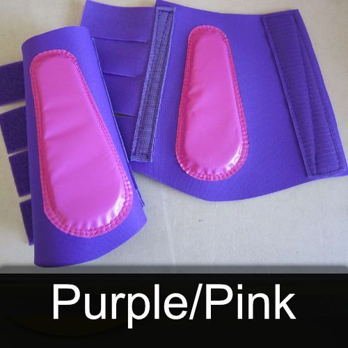 A pair of purple and pink boots with purple and pink padding