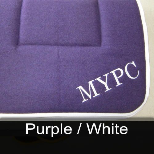 A purple cushion with the name mypc embroidered on it