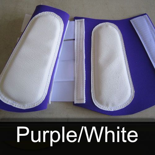 A pair of purple and white leg protectors