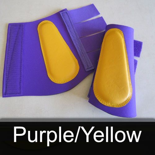 A pair of purple / yellow boots with yellow pads
