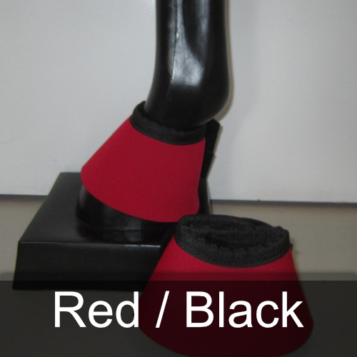A pair of red and black bell boots on a mannequin