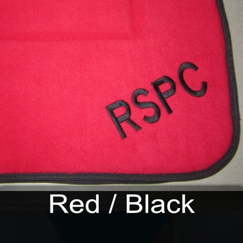 A red blanket with the word rspc embroidered on it