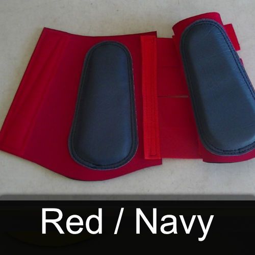 A pair of red / navy boots are sitting on a table