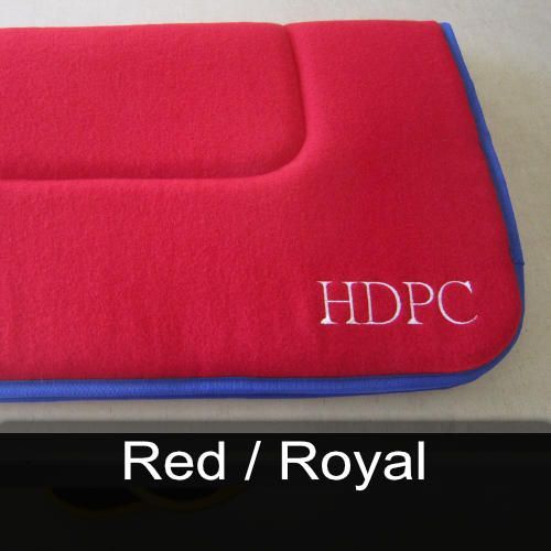 A red saddle pad with hdpc embroidered on it