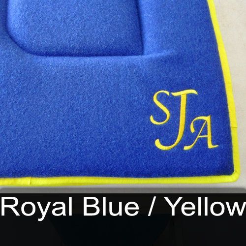 A blue blanket with a yellow border and the name sta embroidered on it