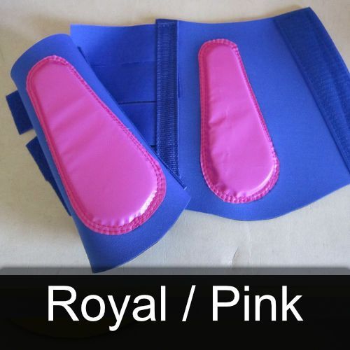 A pair of royal / pink knee pads on a table
