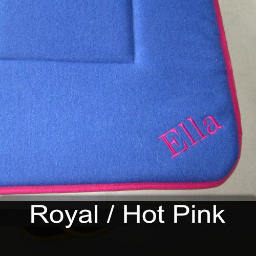 A blue rug with the name ella embroidered on it