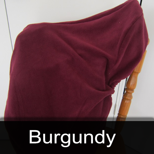 A chair with a burgundy blanket on it