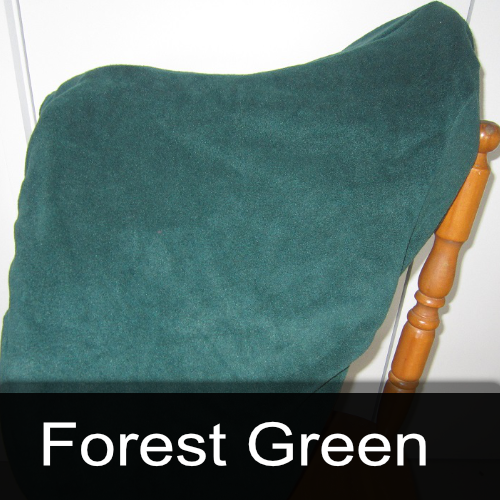 A forest green pillow is sitting on a wooden chair