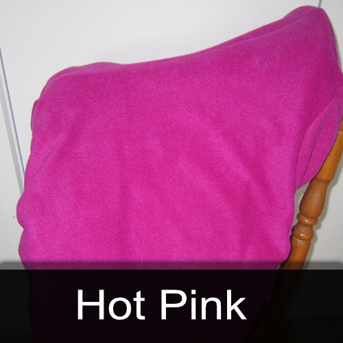 A hot pink blanket is sitting on a chair