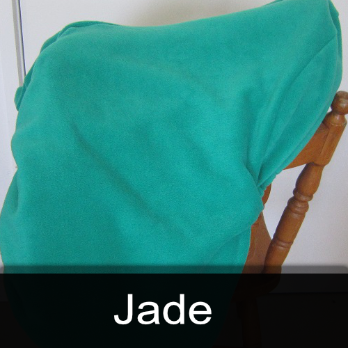 A chair with a green blanket on it and the word jade below it
