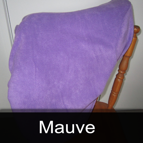A chair with a purple blanket on it that says mauve